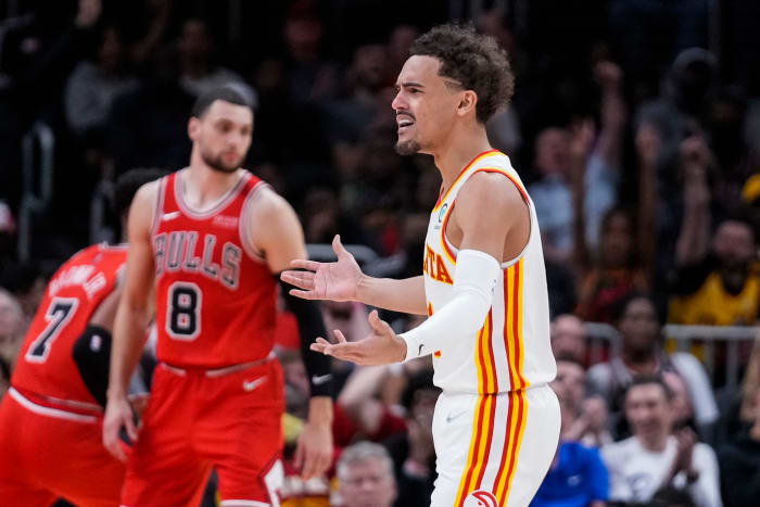 Trae Young questions a referee's call.